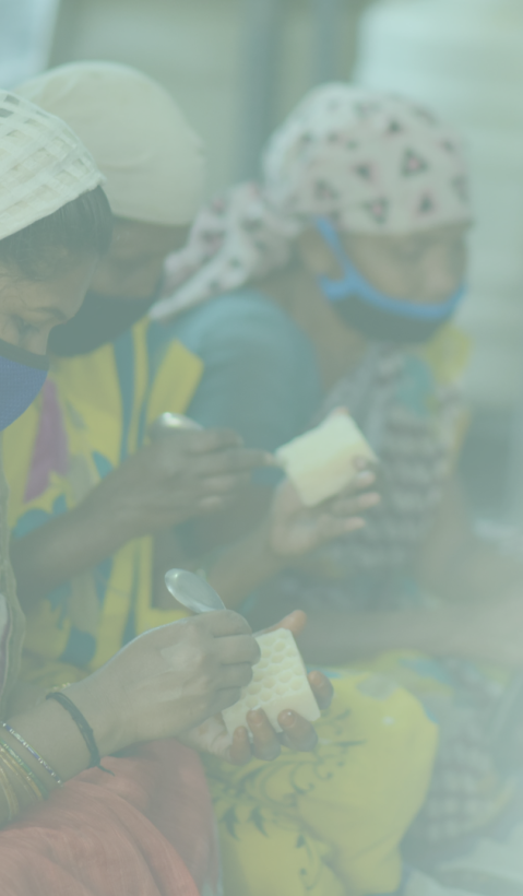 Women in India making candles