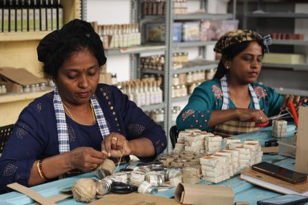 Two women making handcraft products